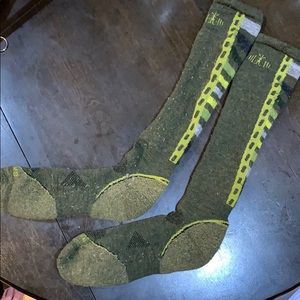 green knee-high Smartwool socks